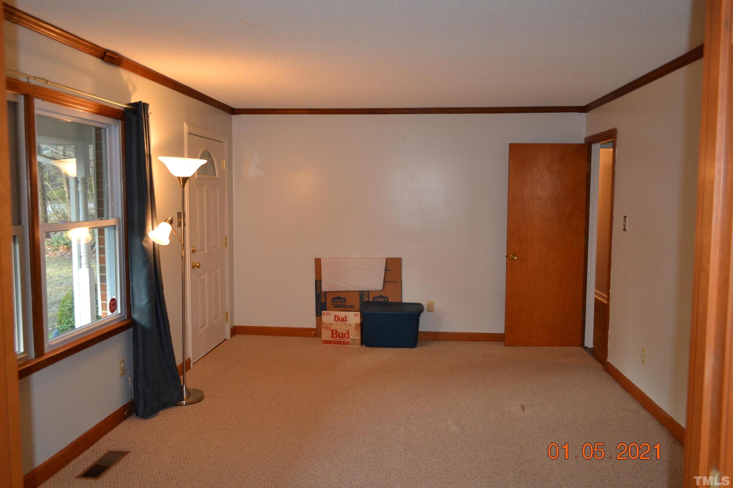 2015 Piney Plains Road Cary, NC 27518 - Photo 19 of 27 a view of a hallway with wooden shelves