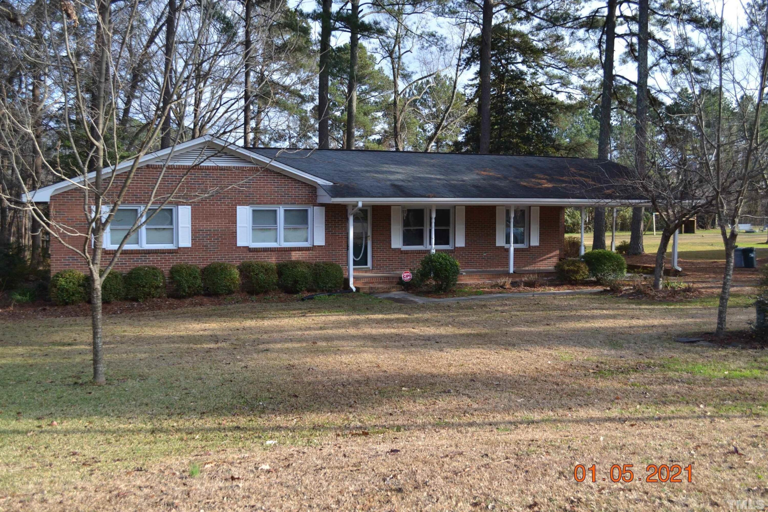 2015 Piney Plains Road Cary, NC 27518 - Photo 2 of 27 a front view of a house with garden