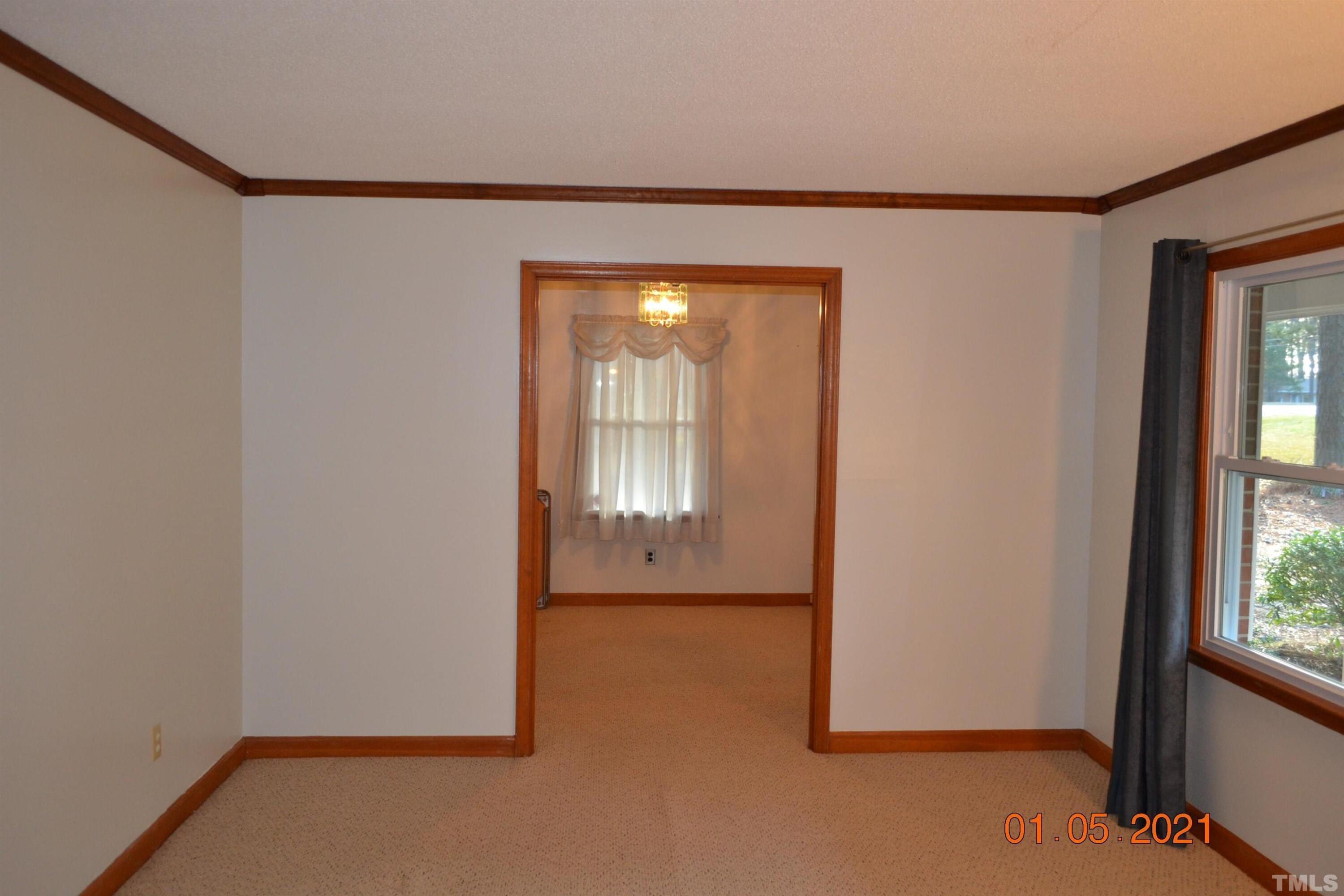 2015 Piney Plains Road Cary, NC 27518 - Photo 21 of 27 a view of an empty room with a window