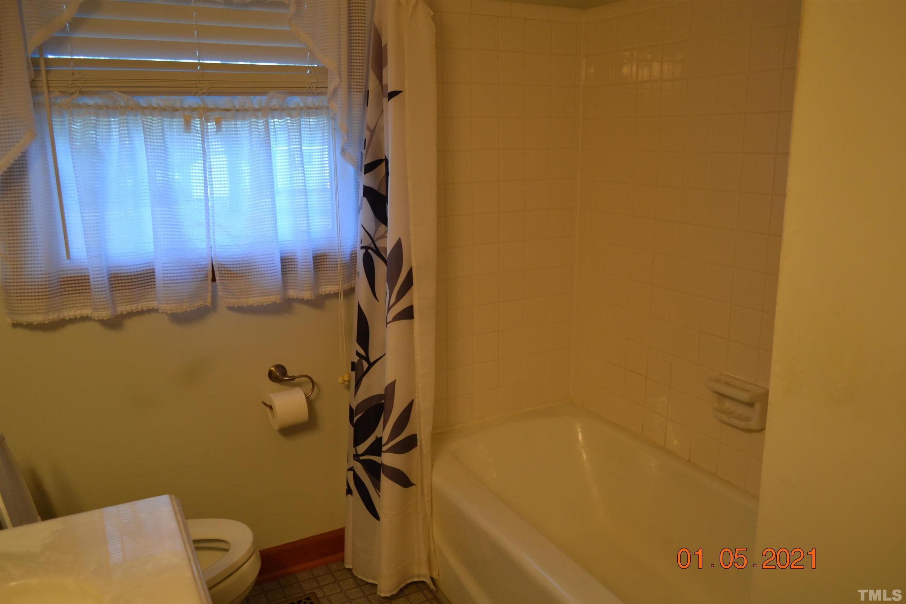 2015 Piney Plains Road Cary, NC 27518 - Photo 24 of 27 a bathroom with a shower