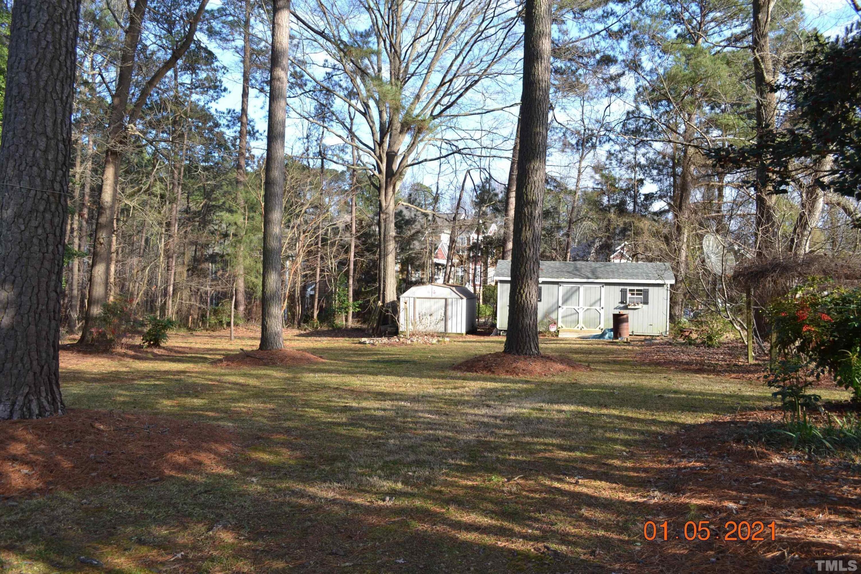 2015 Piney Plains Road Cary, NC 27518 - Photo 6 of 27 a house with trees in front of it