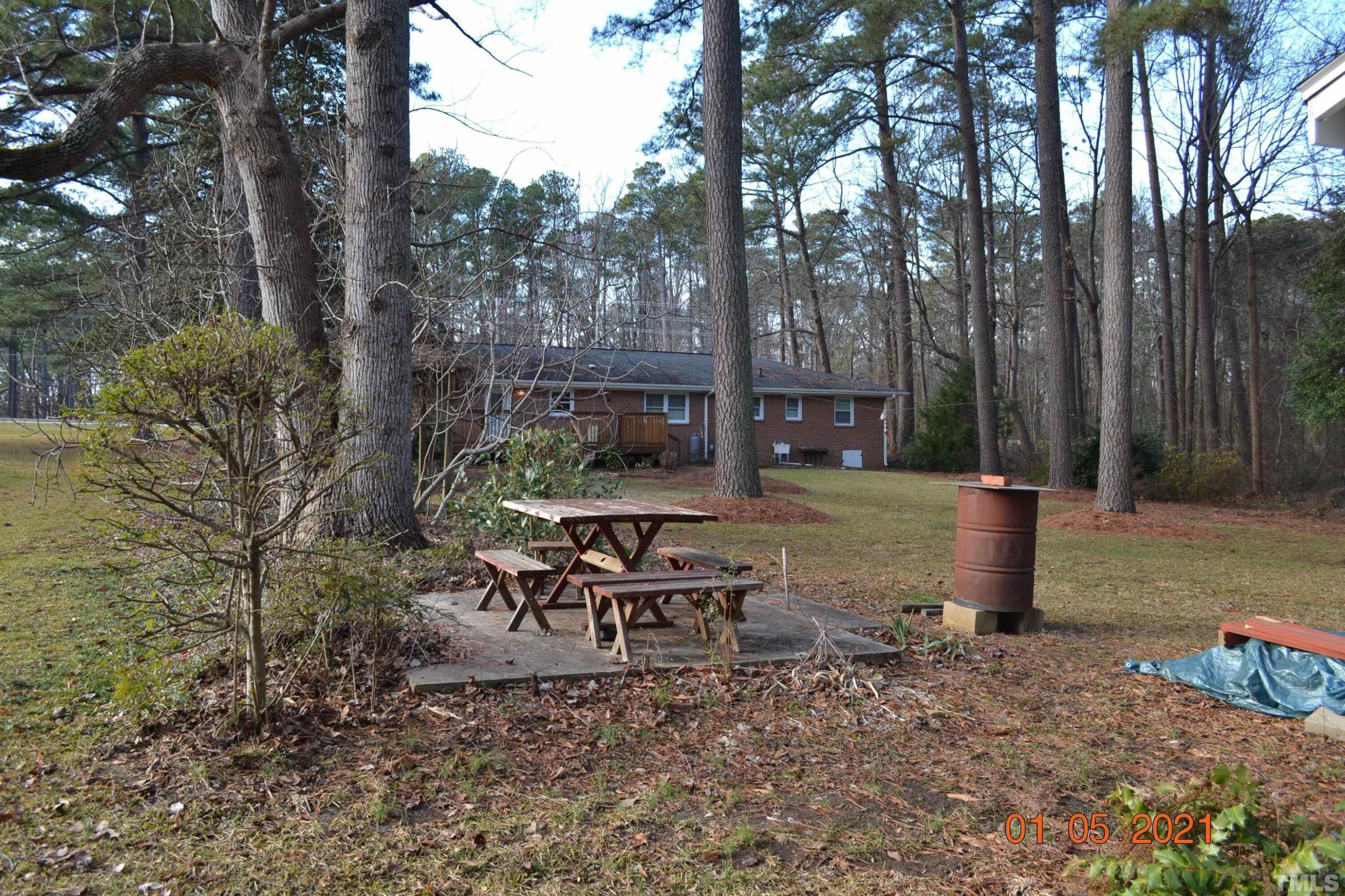 2015 Piney Plains Road Cary, NC 27518 - Photo 8 of 27 a view of a patio with chairs and a fire pit