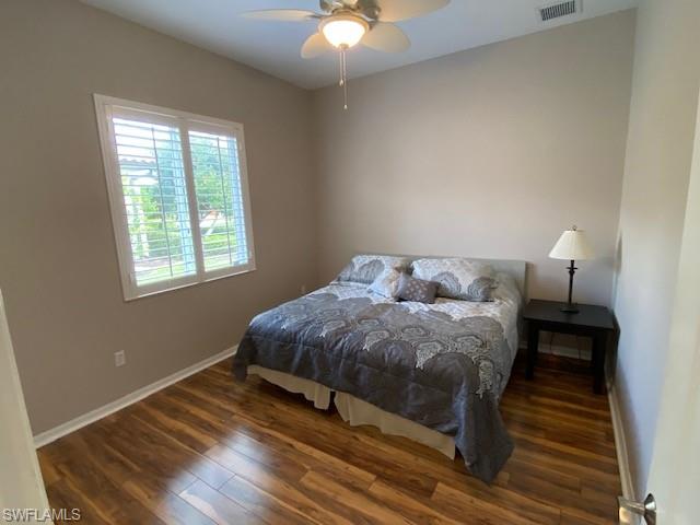 8886 Lely Island Circle Naples, FL 34113 - Photo 11 of 14 a living room with a bed furniture and a window