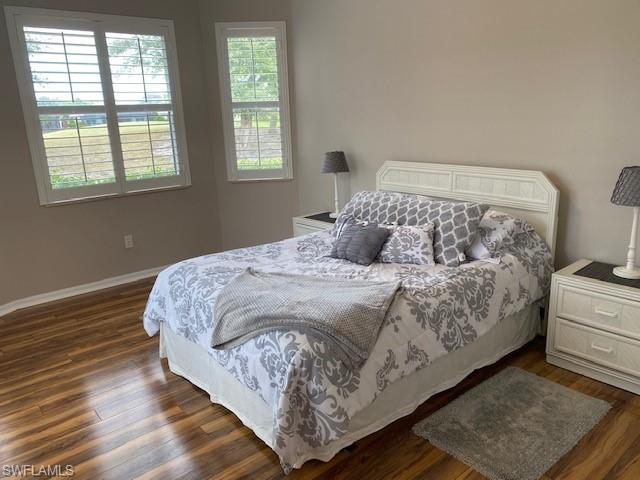 8886 Lely Island Circle Naples, FL 34113 - Photo 13 of 14 a bedroom with a bed and window