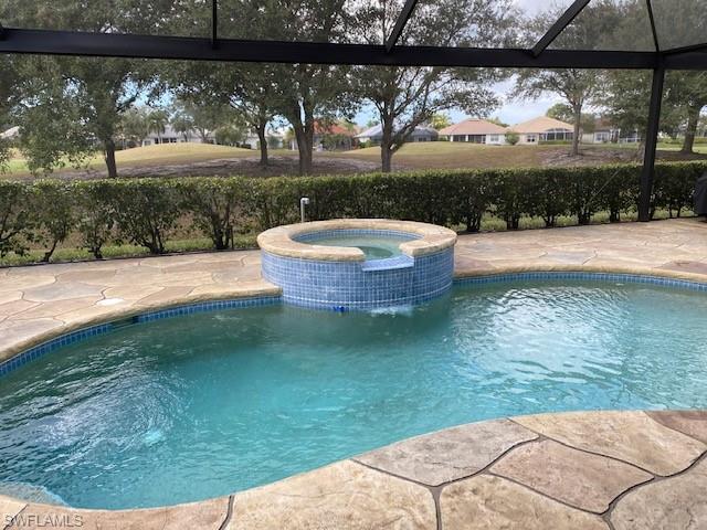 8886 Lely Island Circle Naples, FL 34113 - Photo 4 of 14 a view of swimming pool from a yard