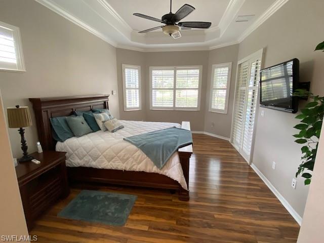8886 Lely Island Circle Naples, FL 34113 - Photo 5 of 14 a bedroom with a bed and a flat screen tv