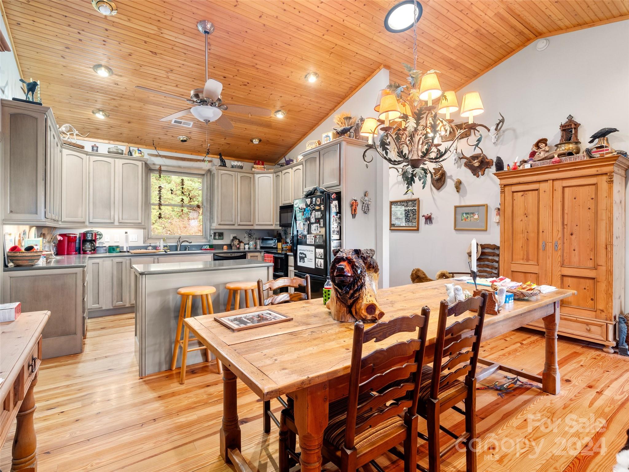 47 Ruffed Grouse Road Brevard, NC 28712 - Photo 16 of 48 a view of a dining room with furniture and wooden floor
