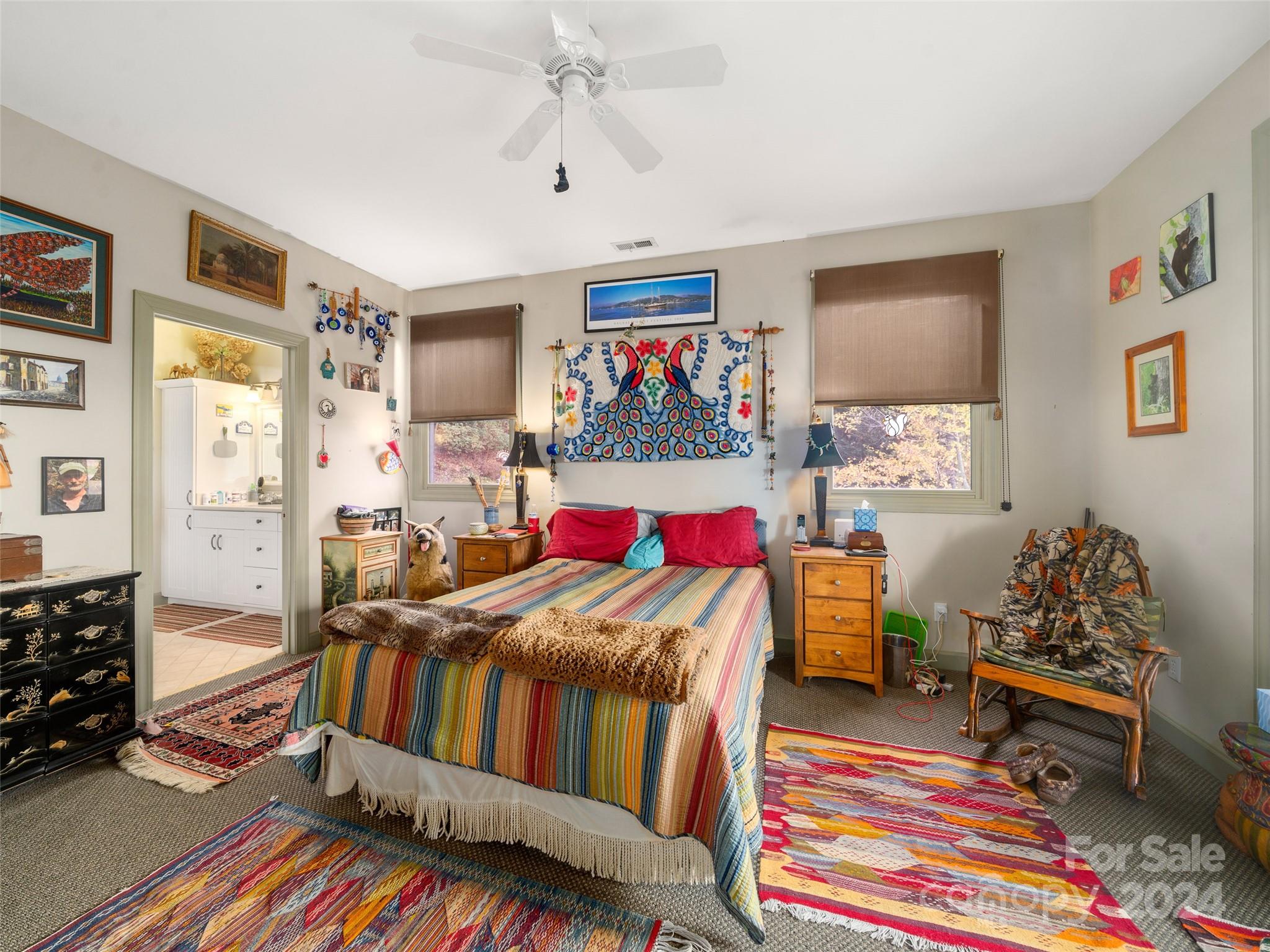 47 Ruffed Grouse Road Brevard, NC 28712 - Photo 25 of 48 a bedroom with furniture and a chandelier