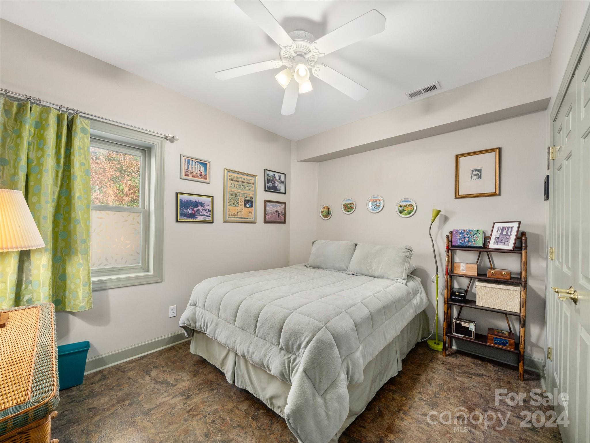 47 Ruffed Grouse Road Brevard, NC 28712 - Photo 39 of 48 a bedroom with a bed and a chandelier
