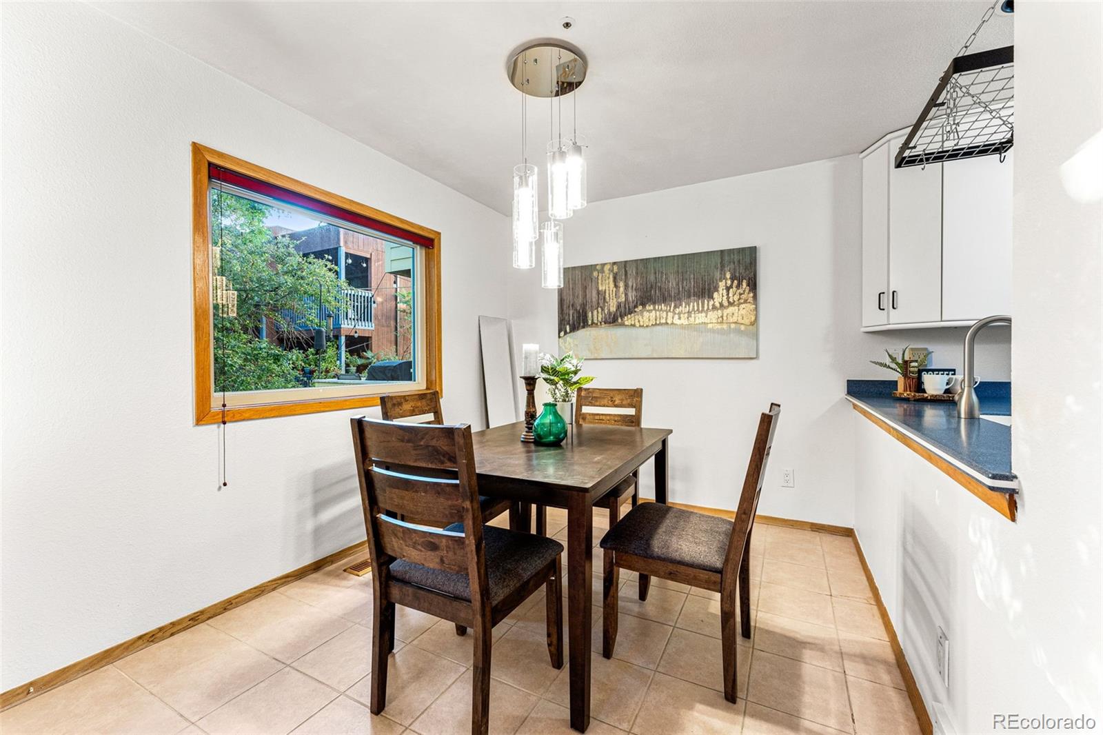 1343 Alpine Avenue Boulder, CO 80304 - Photo 12 of 39 a view of a dining room with furniture window and outside view