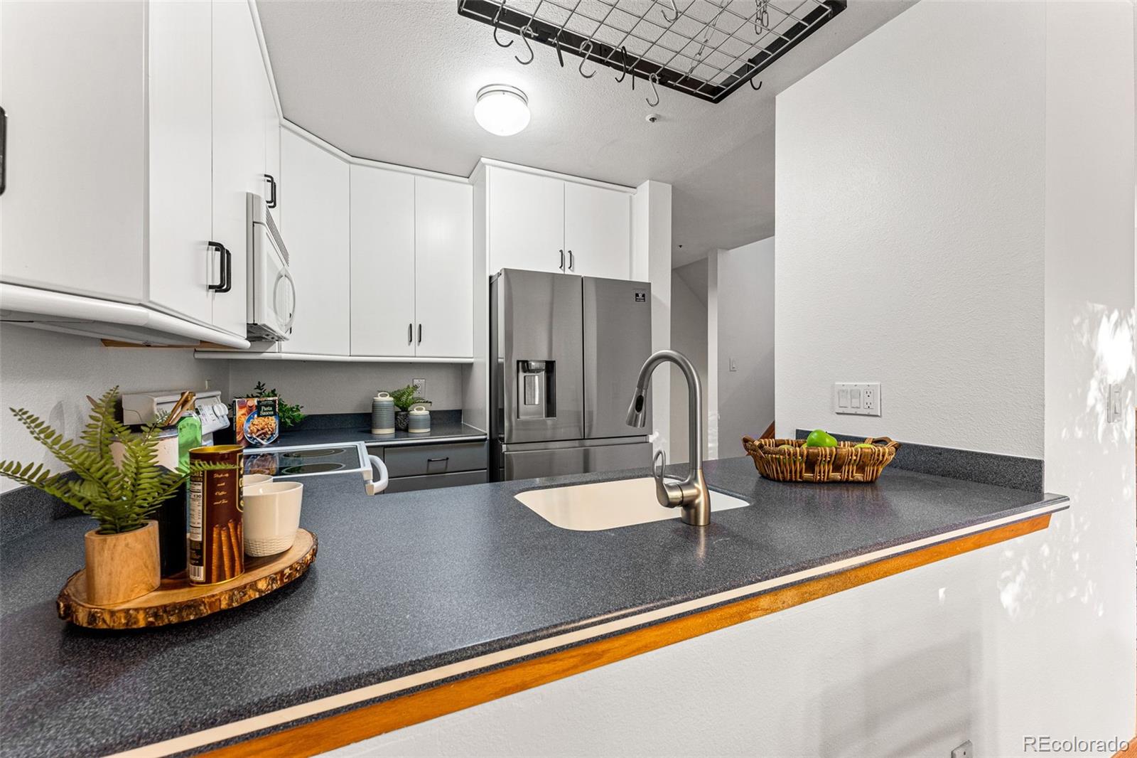 1343 Alpine Avenue Boulder, CO 80304 - Photo 14 of 39 a kitchen with a refrigerator and a sink