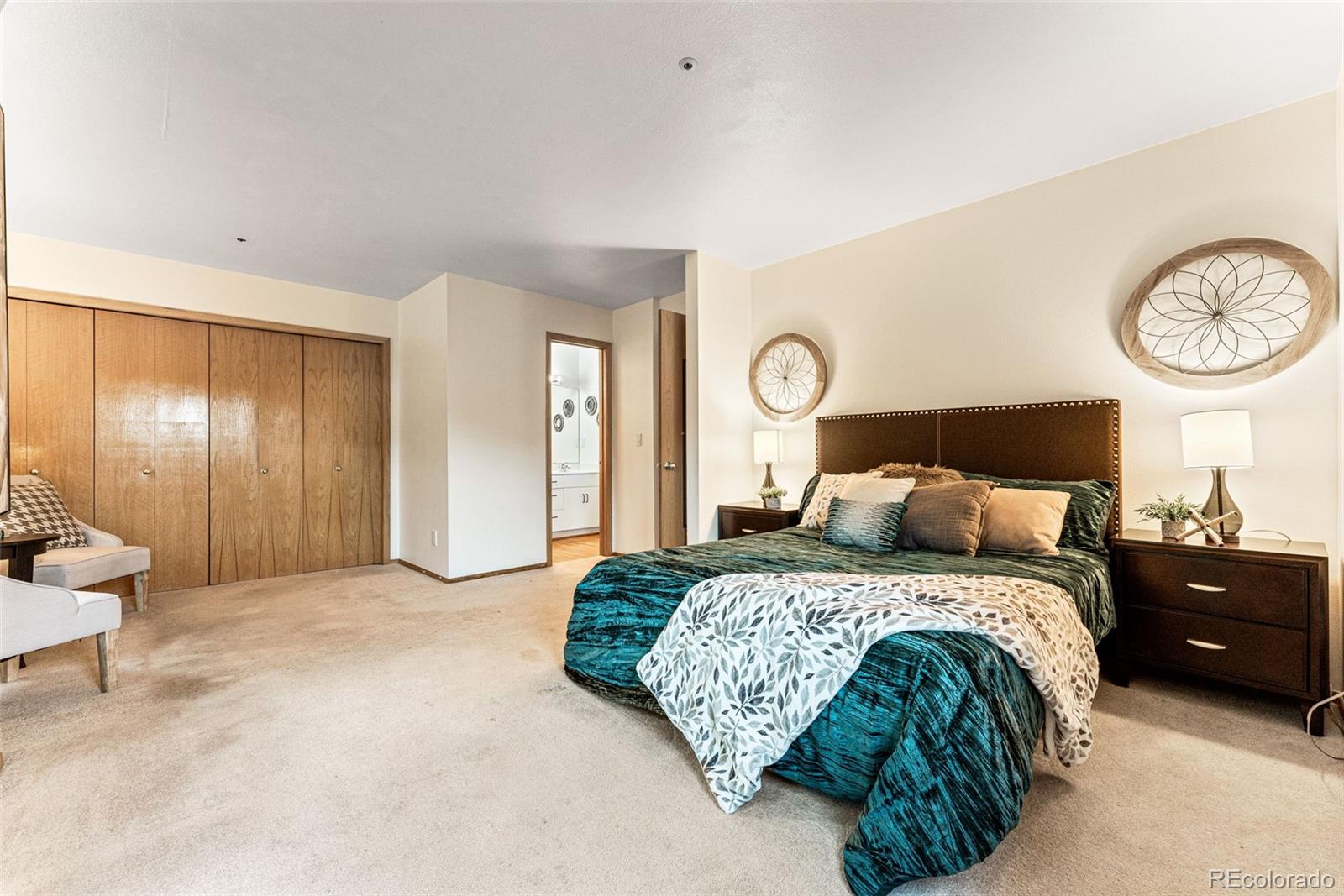1343 Alpine Avenue Boulder, CO 80304 - Photo 23 of 39 a bedroom with a bed and a lamp on dresser