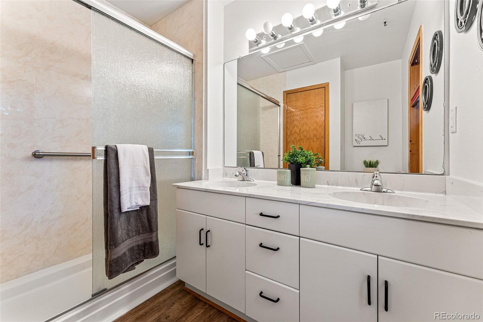 1343 Alpine Avenue Boulder, CO 80304 - Photo 25 of 39 a bathroom with a double vanity sink mirror and shower
