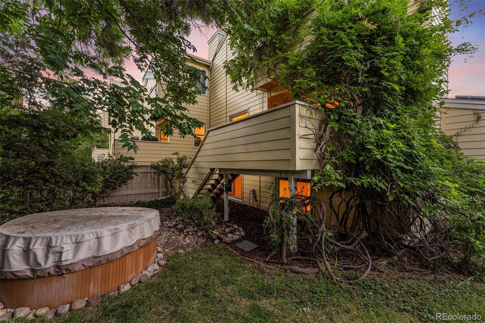 1343 Alpine Avenue Boulder, CO 80304 - Photo 33 of 39 a view of a backyard with plants and large trees