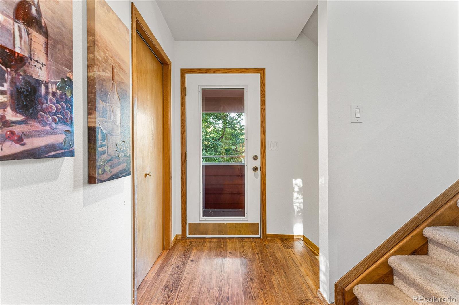1343 Alpine Avenue Boulder, CO 80304 - Photo 7 of 39 a view of a hallway with wooden floor and a window