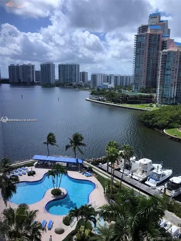 a view of a lake with a garden and trees