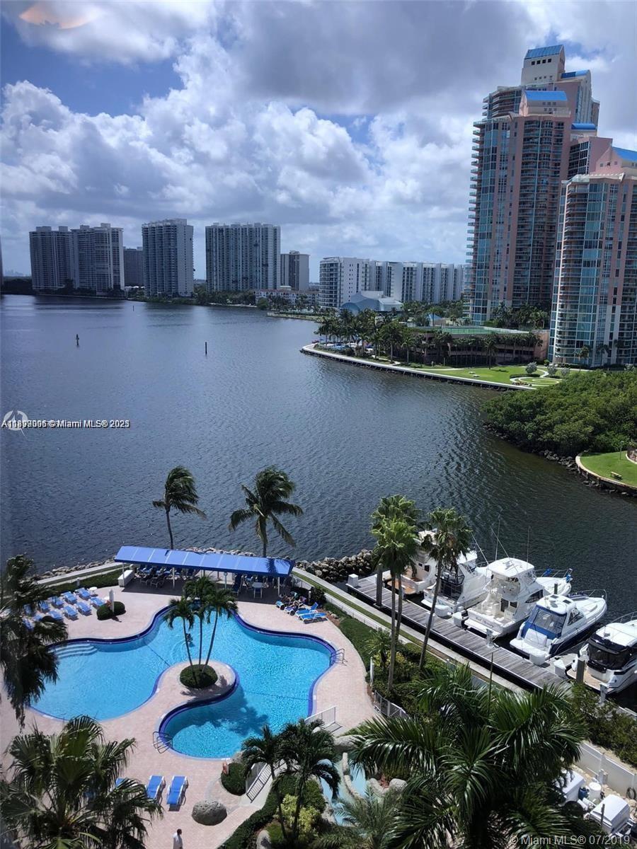 3530 Mystic Pointe Drive, Unit 1008 Aventura, FL 33180 - Photo 27 of 32 a view of a lake with a city