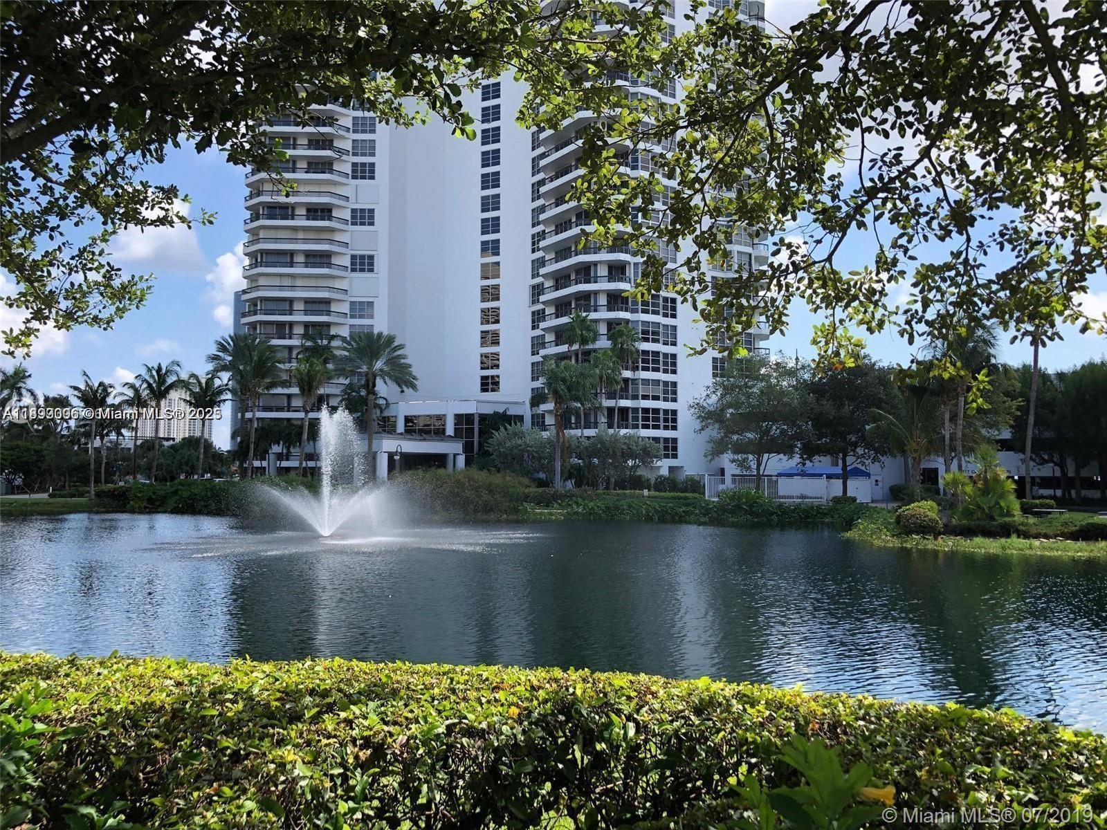 3530 Mystic Pointe Drive, Unit 1008 Aventura, FL 33180 - Photo 30 of 32 a view of a lake with building and lake view