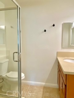 16642 Goldenwest Street Huntington Beach, CA 92647 - Photo 16 of 27 a bathroom with a granite countertop sink toilet and shower