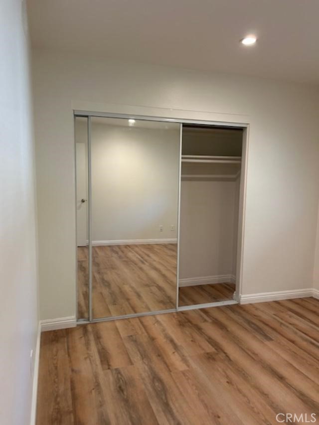 16642 Goldenwest Street Huntington Beach, CA 92647 - Photo 20 of 27 an empty room with wooden floor and closet
