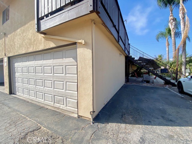 16642 Goldenwest Street Huntington Beach, CA 92647 - Photo 26 of 27 a view of a porch with a table and chairs and potted plants