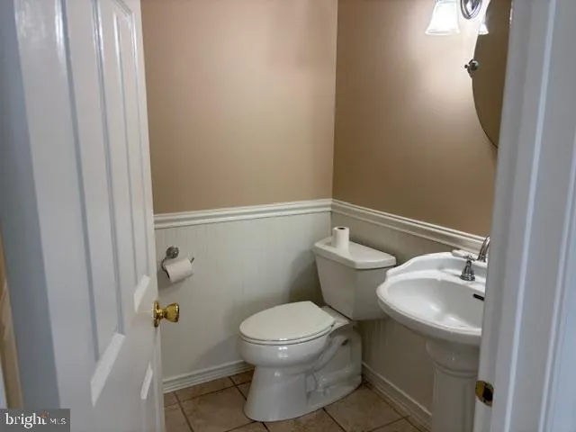 a bathroom with a toilet and a sink