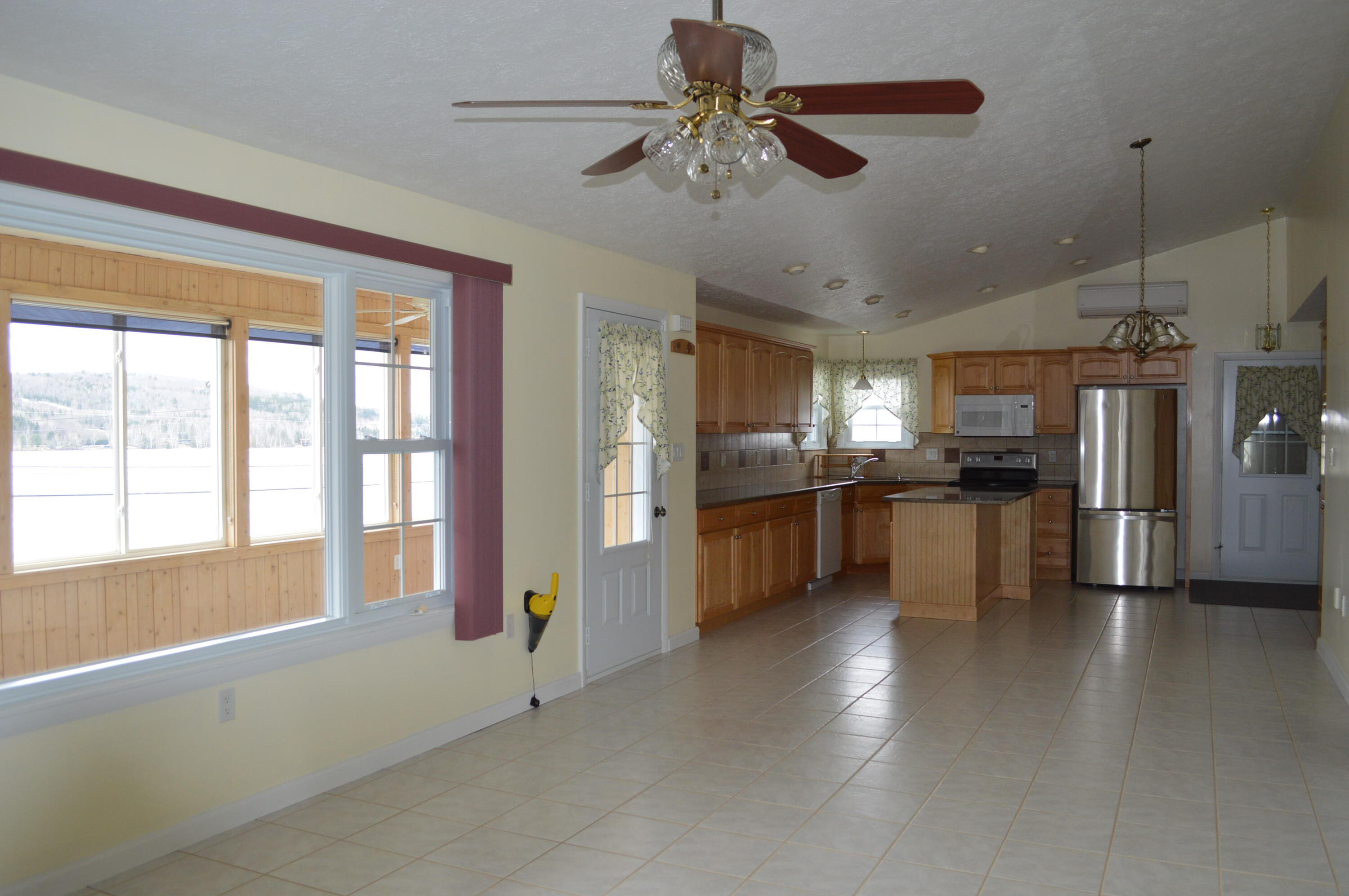 2589 Aroostook Road Eagle Lake, ME 04739 - Photo 47 of 65 Living room to porch and kitchen