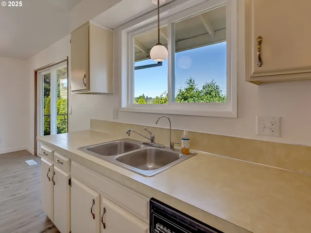 a kitchen with a sink and a window