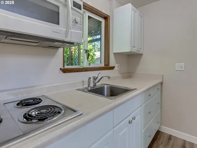 a kitchen with sink and window