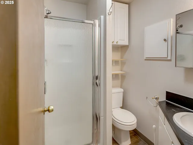 a white toilet sitting next to a bathroom sink