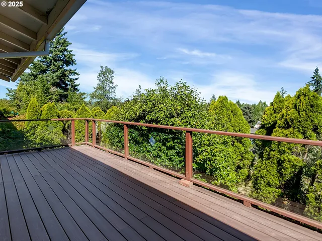 a view of balcony with wooden floor