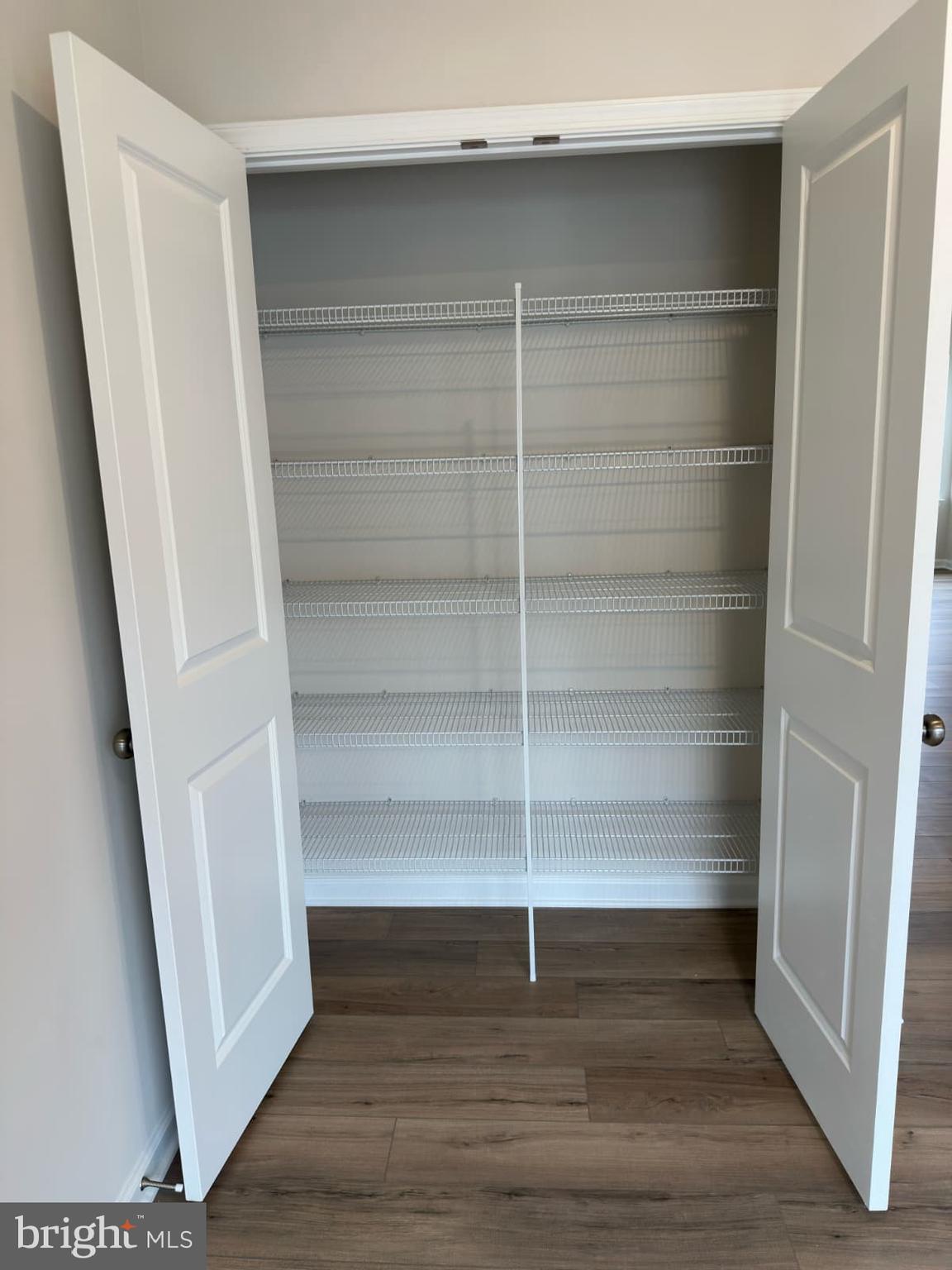 1256 Red Clover Lane, Unit 149 Ranson, WV 25438 - Photo 11 of 17 a view of walk in closet with empty racks