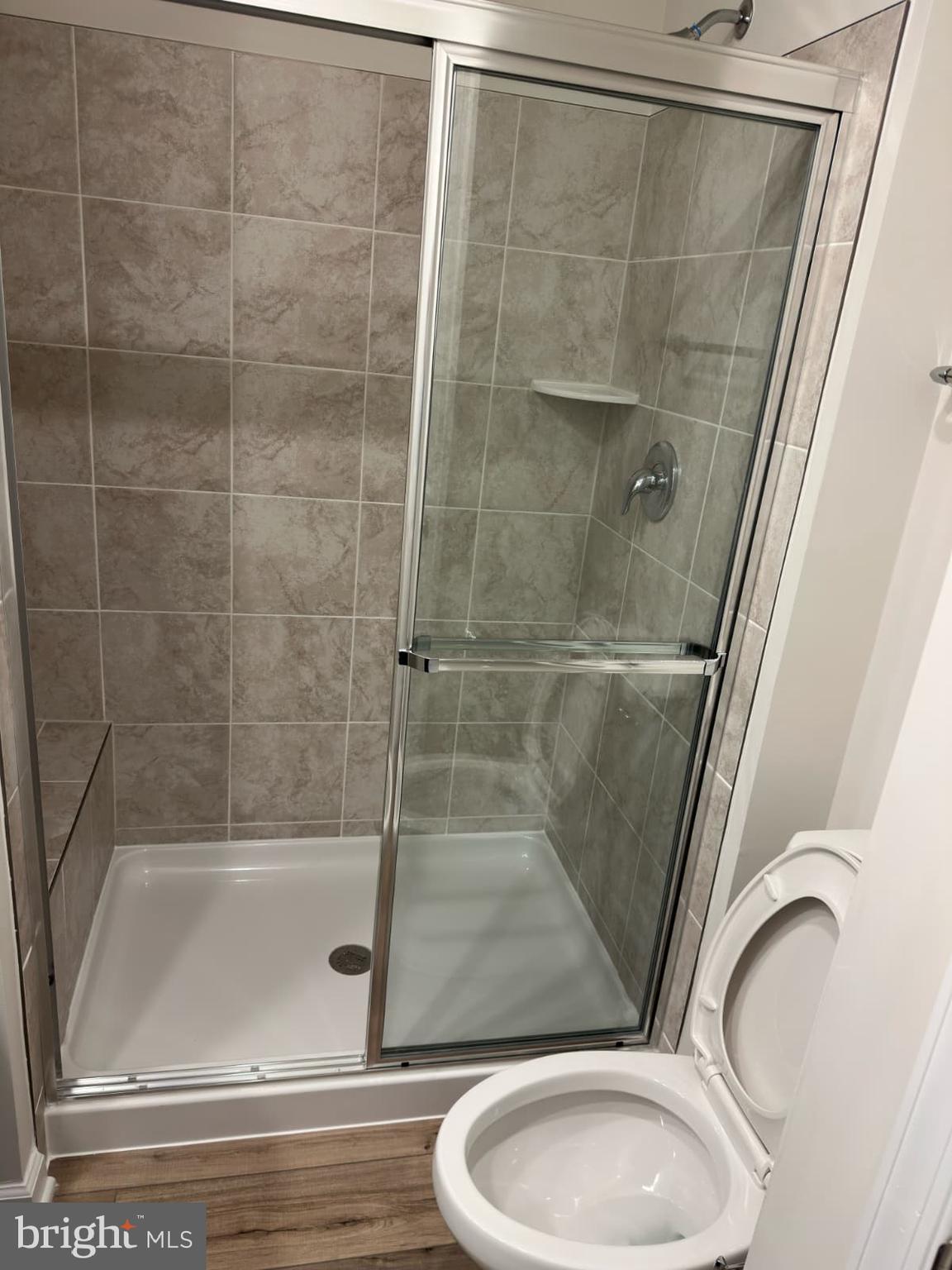 1256 Red Clover Lane, Unit 149 Ranson, WV 25438 - Photo 13 of 17 a bathroom with a granite countertop sink toilet and shower