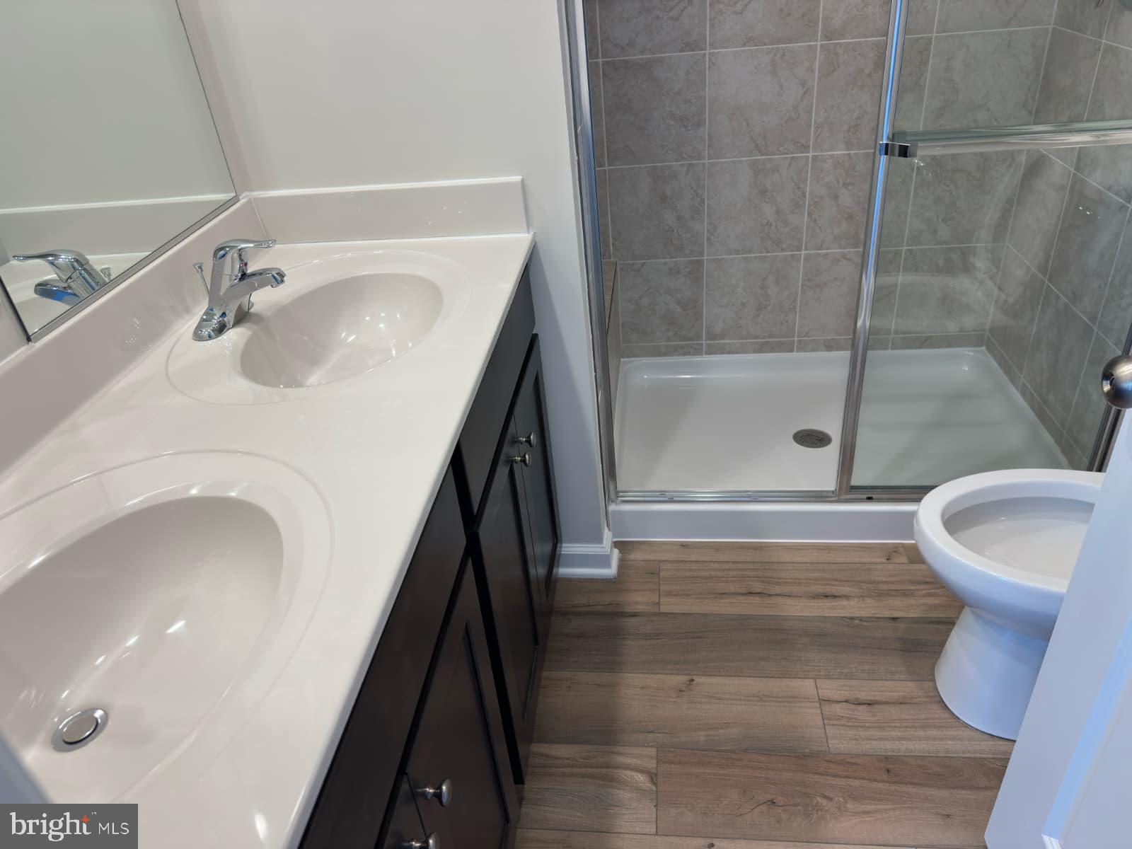 1256 Red Clover Lane, Unit 149 Ranson, WV 25438 - Photo 17 of 17 a bathroom with a sink and a mirror