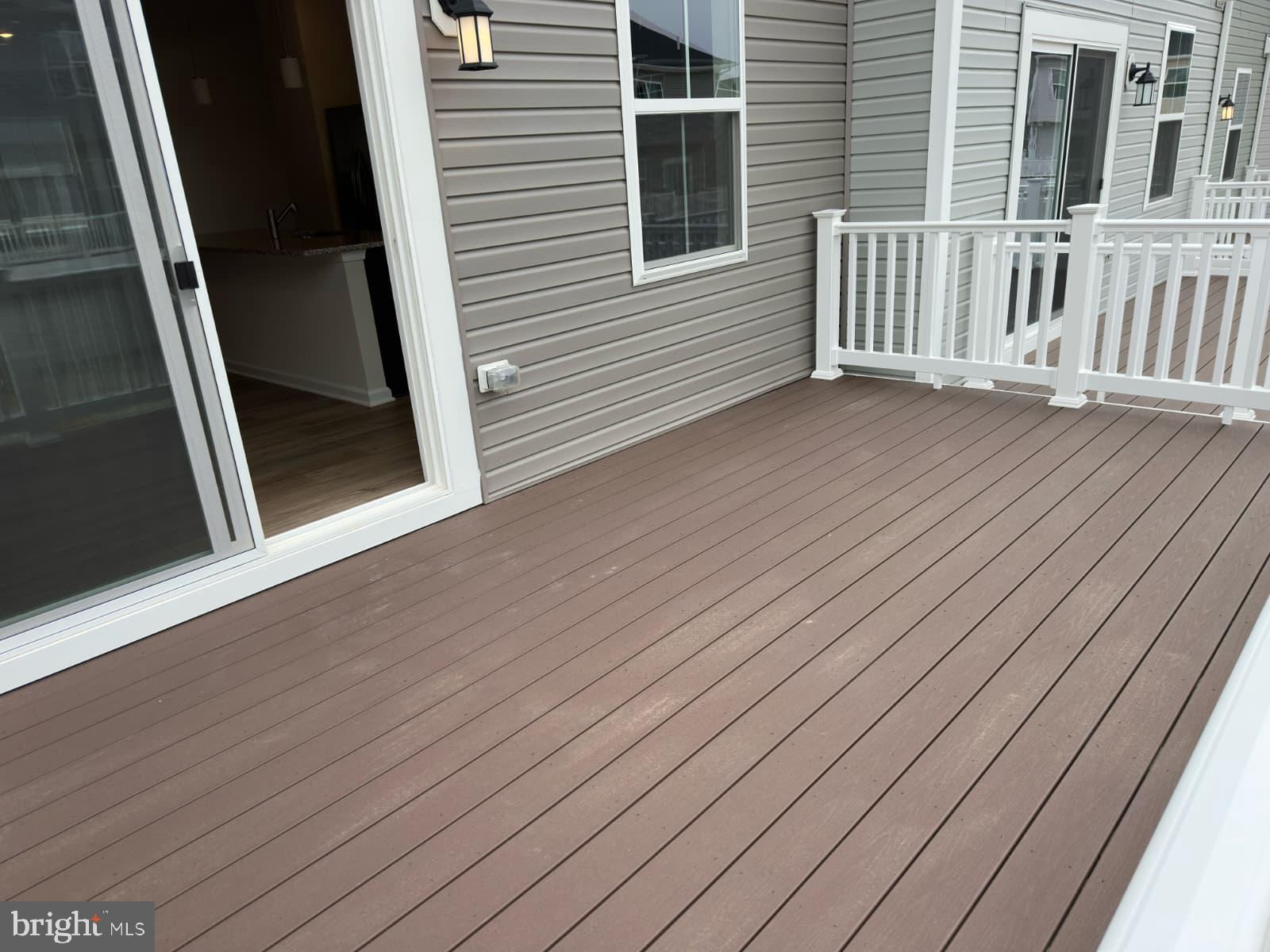 1256 Red Clover Lane, Unit 149 Ranson, WV 25438 - Photo 8 of 17 a view of a house with wooden deck