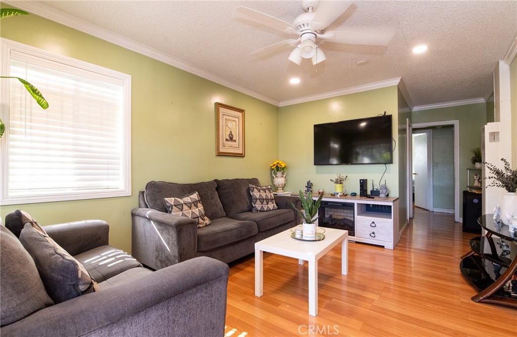 2121 East Shauer Street Compton, CA 90222 - Photo 12 of 30 a living room with furniture and a flat screen tv
