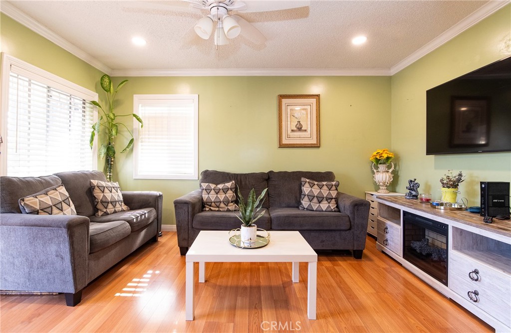 2121 East Shauer Street Compton, CA 90222 - Photo 13 of 30 a living room with furniture and a flat screen tv