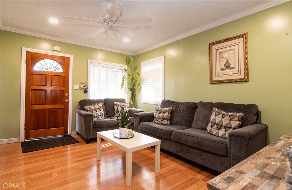 2121 East Shauer Street Compton, CA 90222 - Photo 14 of 30 a living room with furniture and a window