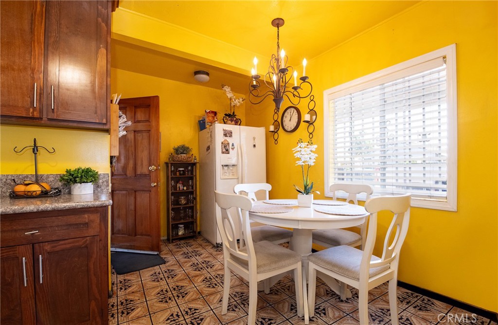 2121 East Shauer Street Compton, CA 90222 - Photo 15 of 30 a view of a dining room with furniture and window