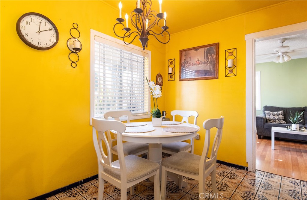 2121 East Shauer Street Compton, CA 90222 - Photo 18 of 30 a view of a dining room with furniture and wooden floor