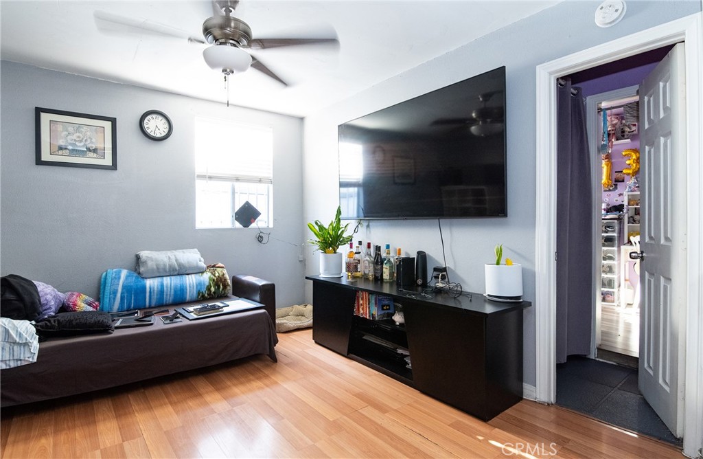 2121 East Shauer Street Compton, CA 90222 - Photo 23 of 30 a living room with furniture and a flat screen tv