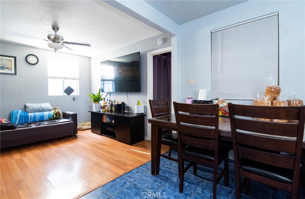 2121 East Shauer Street Compton, CA 90222 - Photo 27 of 30 a room with a couch and a dining table