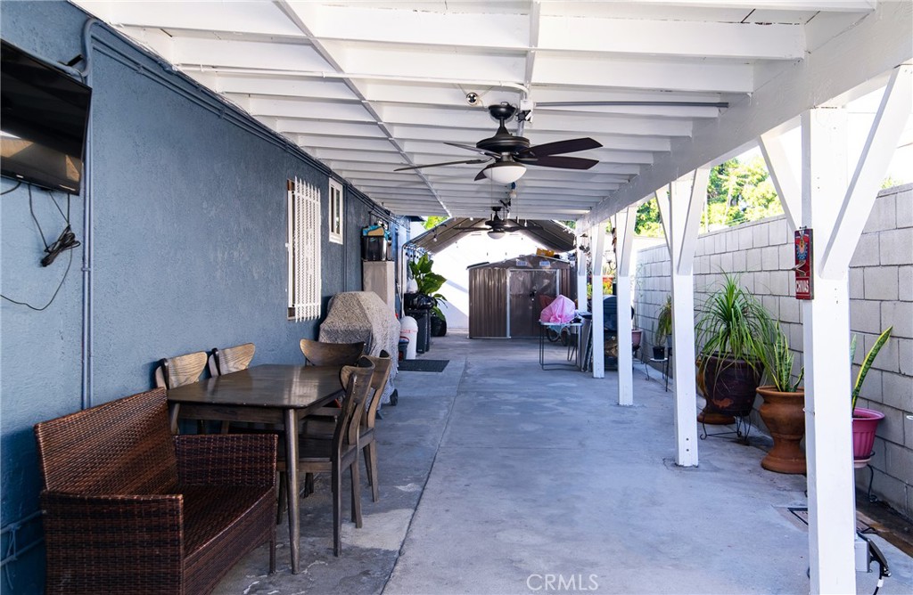 2121 East Shauer Street Compton, CA 90222 - Photo 7 of 30 a view of a livingroom with furniture and a flat screen tv