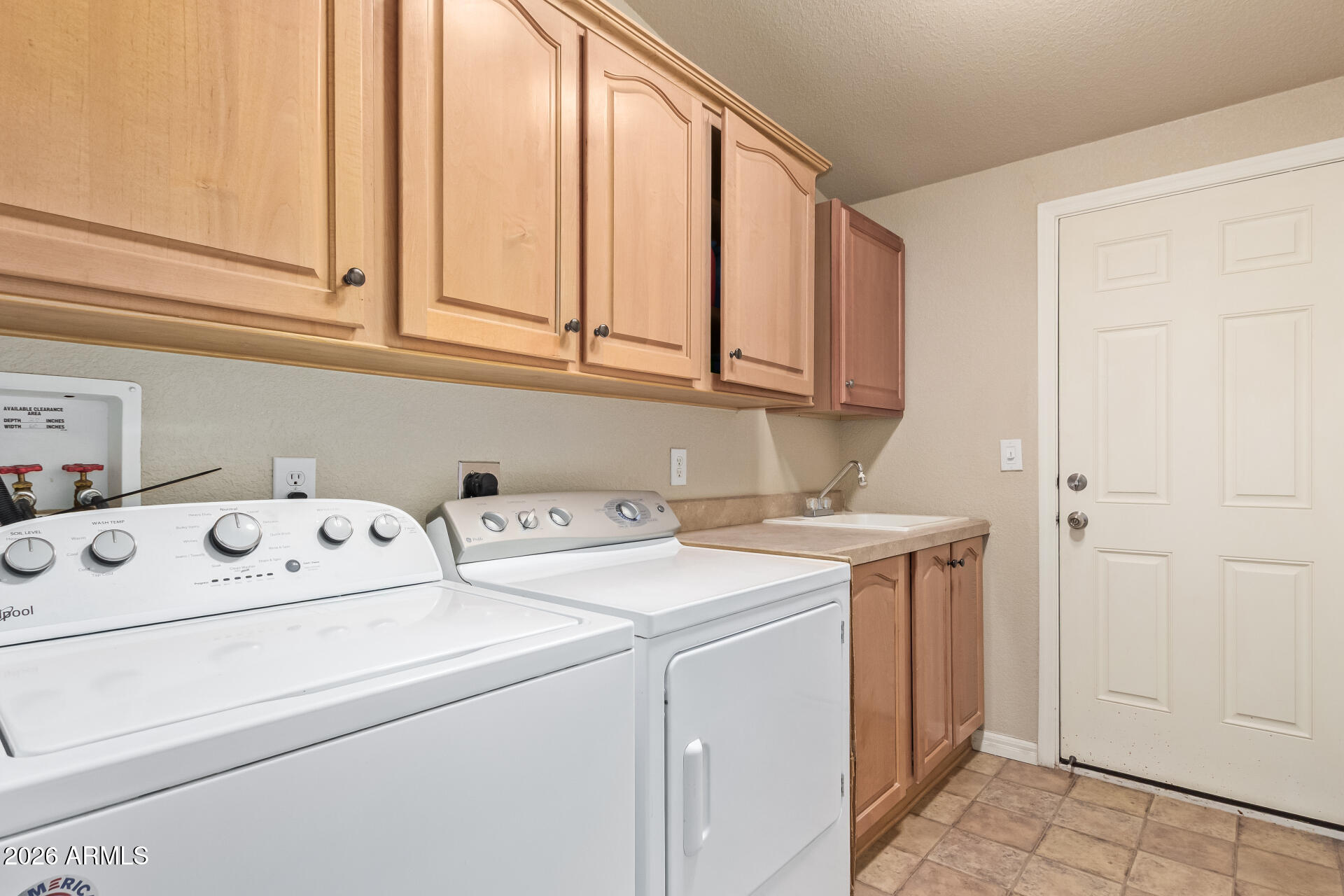 3301 South Goldfield Road, Unit 4028 Apache Junction, AZ 85119 - Photo 27 of 43 a utility room with dryer and washer