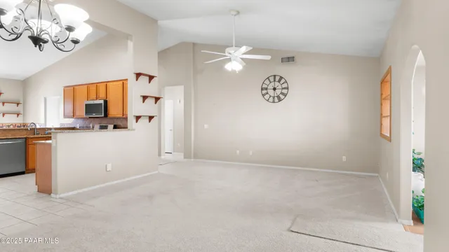 a view of a kitchen with a sink dishwasher a refrigerator and a stove top oven