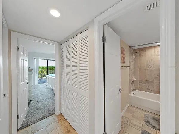 a view of a bathroom with a glass door shower