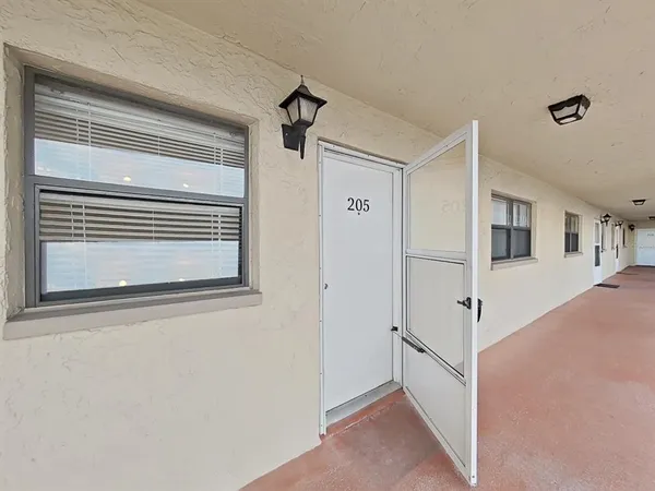 a view of a room that has a large window