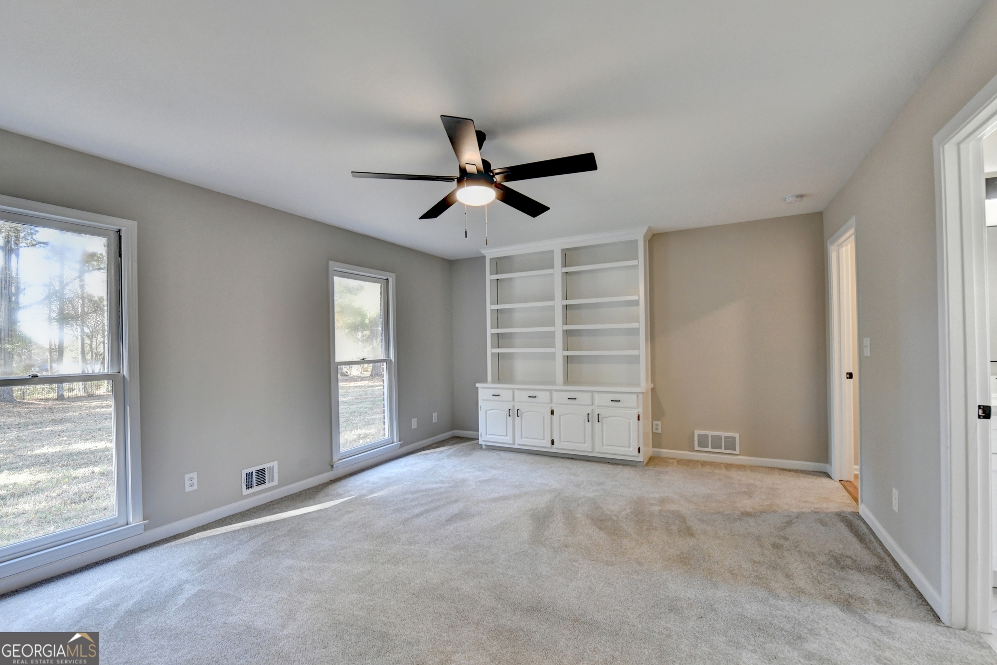 590 Manning Gin Road Monroe, GA 30656 - Photo 32 of 82 a view of an empty room with a window
