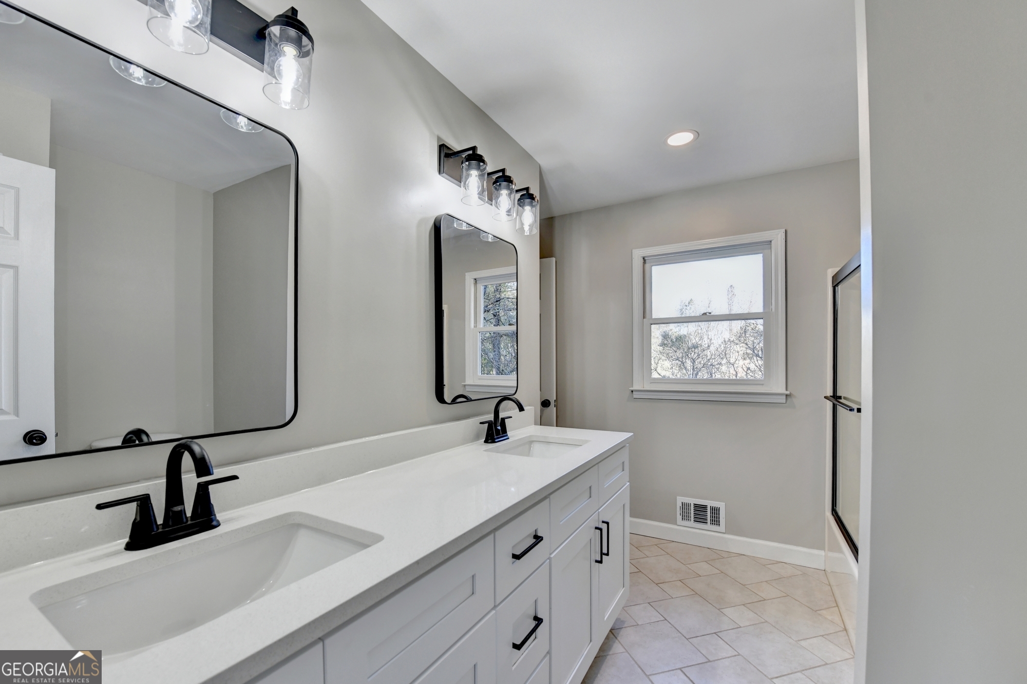 590 Manning Gin Road Monroe, GA 30656 - Photo 34 of 82 a bathroom with a sink and a mirror