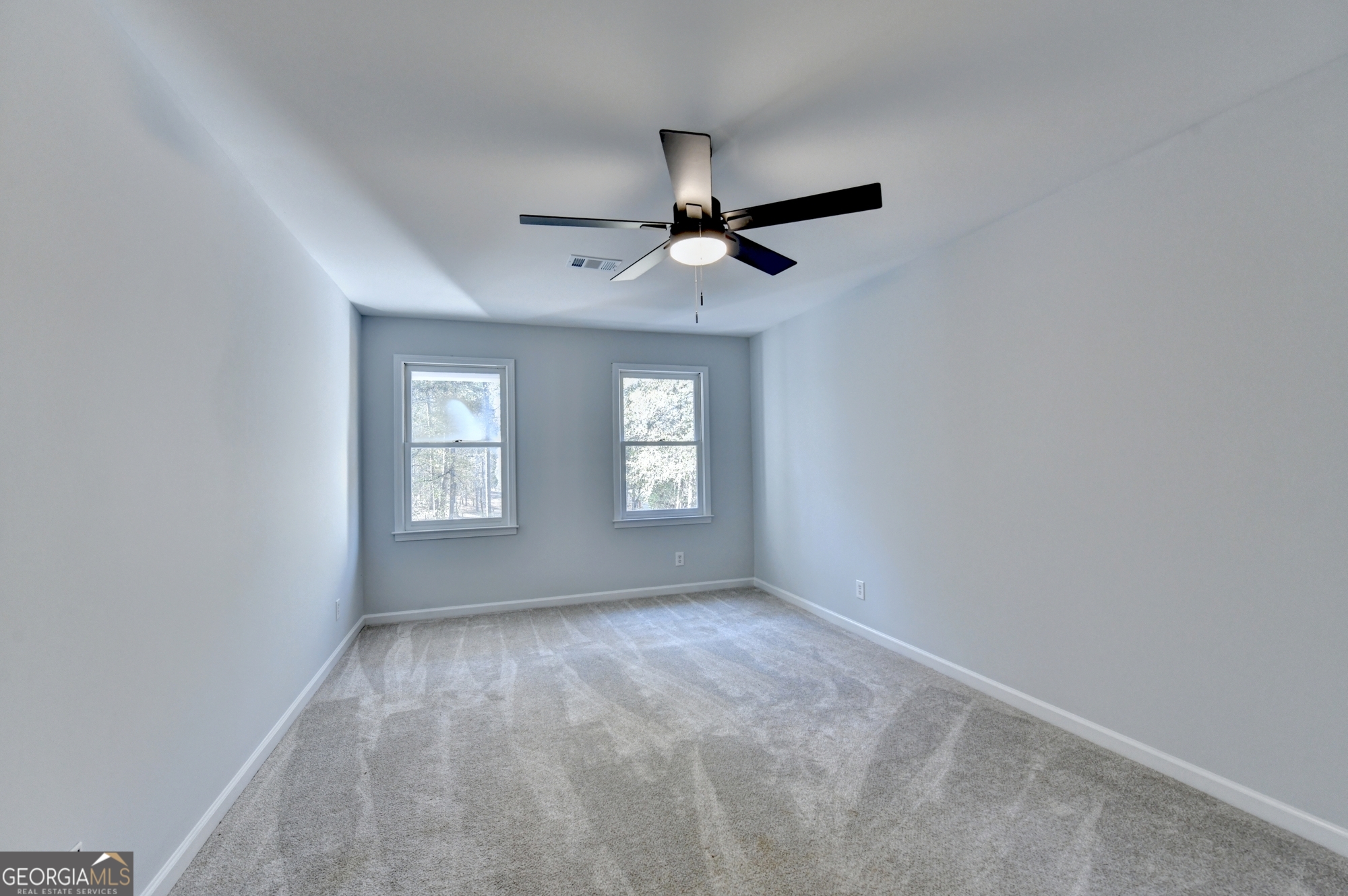 590 Manning Gin Road Monroe, GA 30656 - Photo 41 of 82 a view of room with a ceiling fan and window